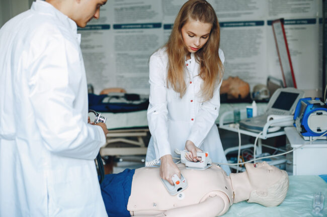 nurse-conducts-resuscitation-doctor-helps-woman-perform-operation-students-practice-medicine